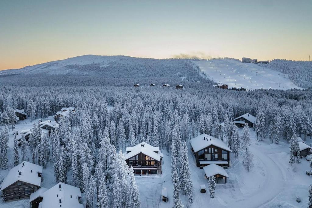 an aerial view of a resort with snow covered trees at Villa Bear Den in Kittilä