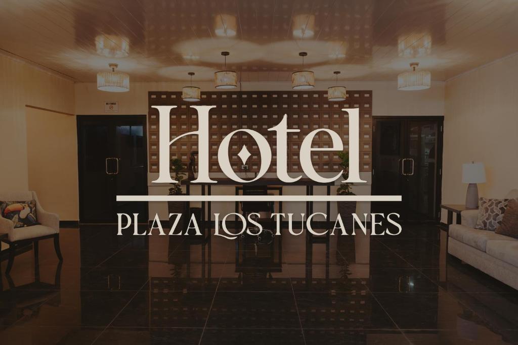 a lobby with a hotel sign in a room at Hotel Plaza Los Tucanes in Santiago