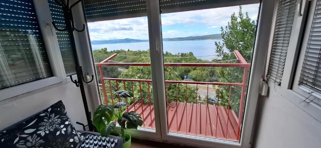 a balcony with a view of the water at Apartman Lea in Crikvenica