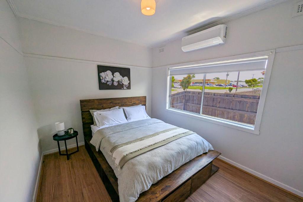 a bedroom with a large bed and a window at Home in Moe in Moe