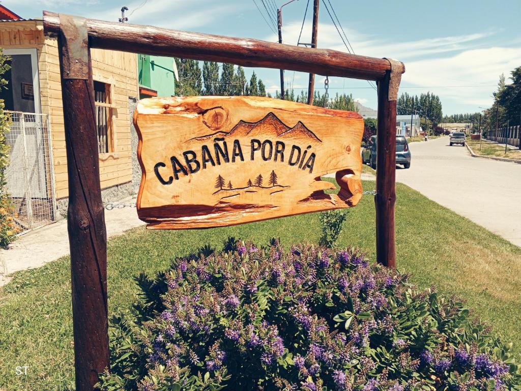 a sign for a cattama ford district at Cabaña azul in Los Antiguos