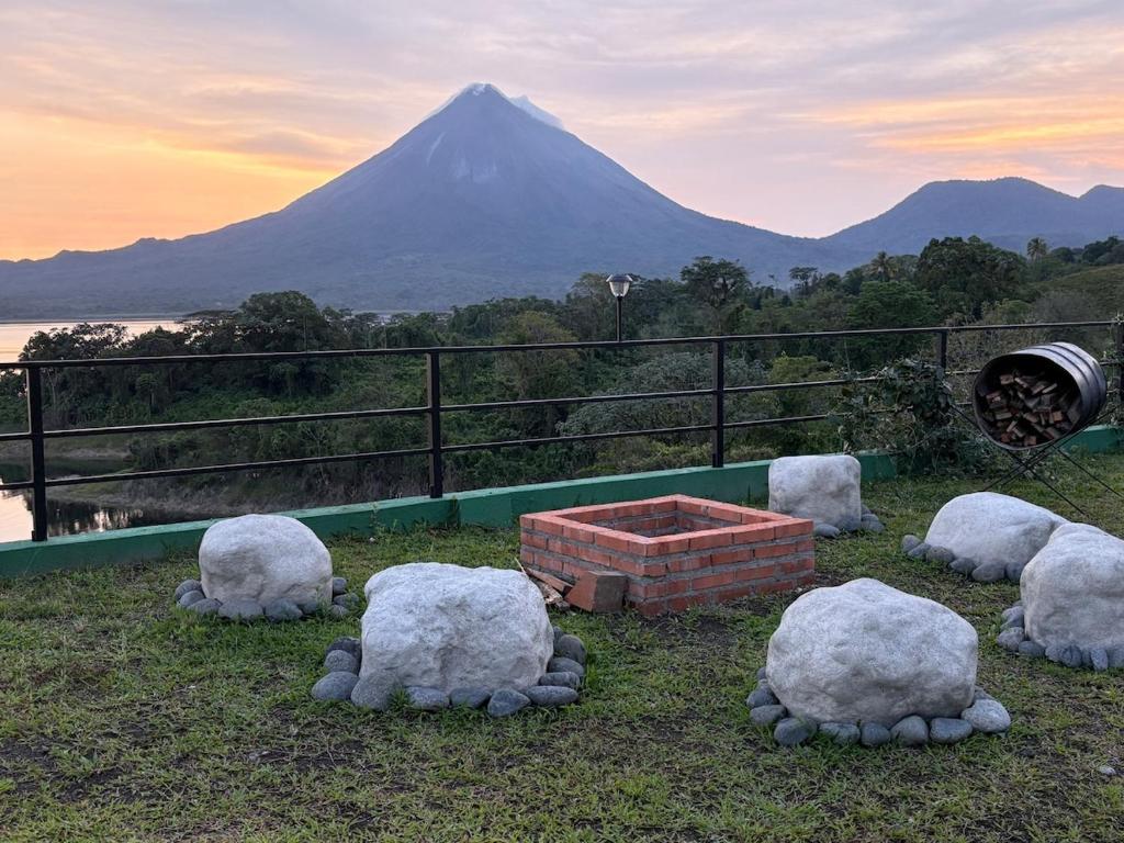 a group of sheep statues in front of a mountain at Cabin Casove in El Castillo de La Fortuna