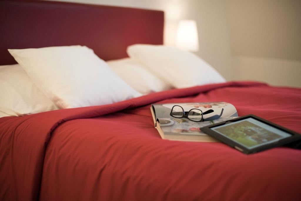 Postel nebo postele na pokoji v ubytování Hotel Glockenhof Zürich