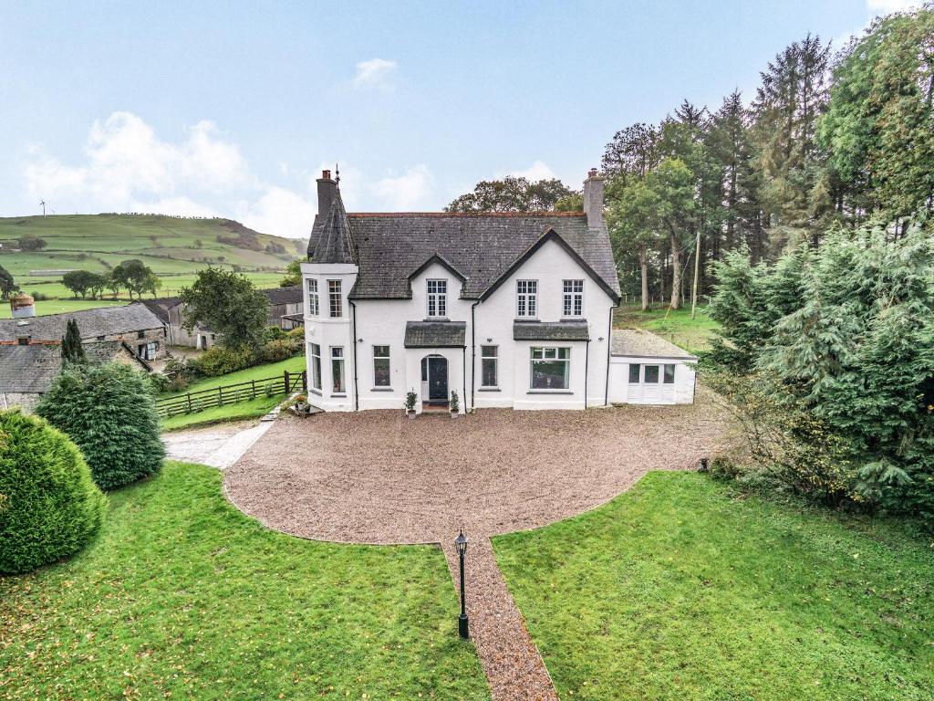 an aerial view of a white house with a large yard at Groudd Hall in Cerrigydrudion