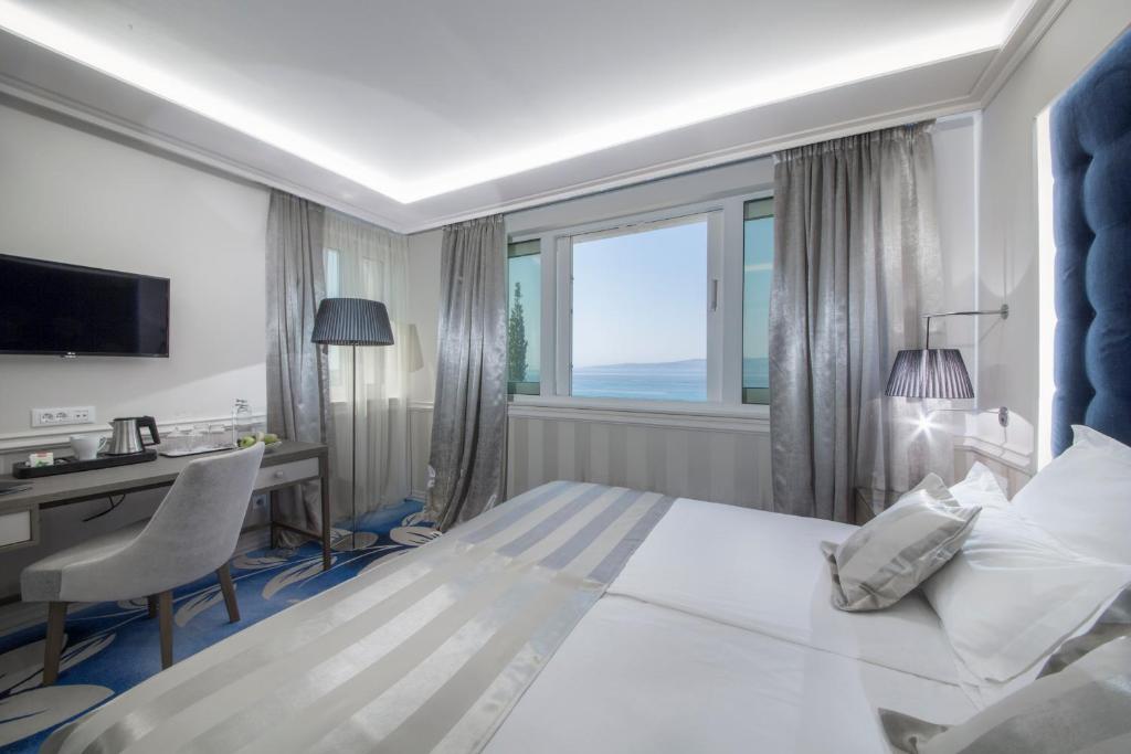 Posteľ alebo postele v izbe v ubytovaní Grand Hotel Slavia - Adults only