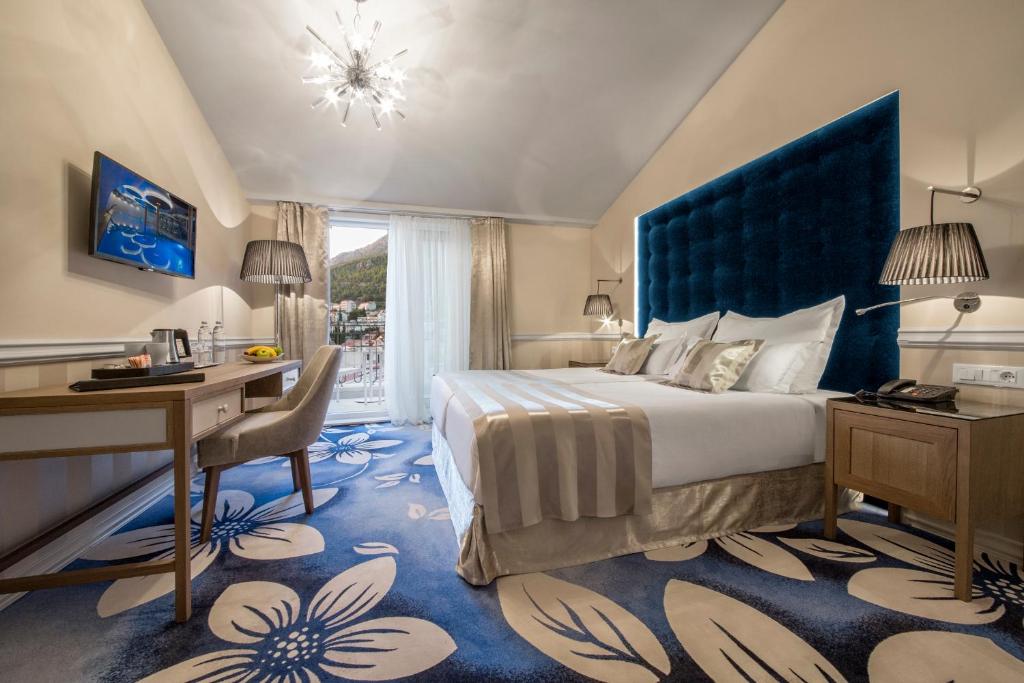 Posteľ alebo postele v izbe v ubytovaní Grand Hotel Slavia - Adults only