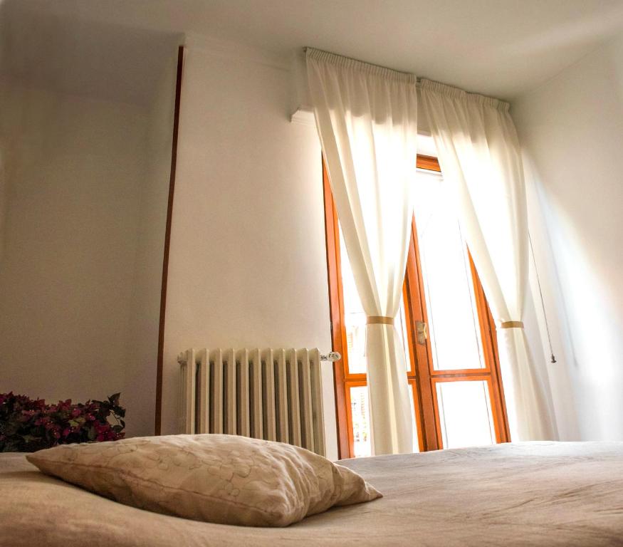 Postel nebo postele na pokoji v ubytování Domus Hotel