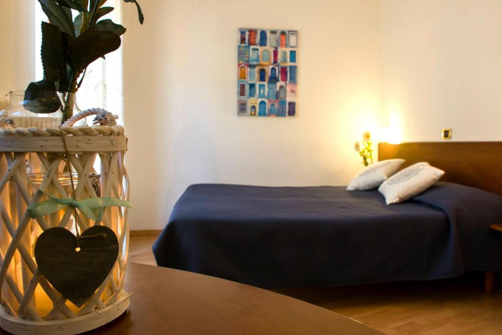 Postel nebo postele na pokoji v ubytování Domus Hotel
