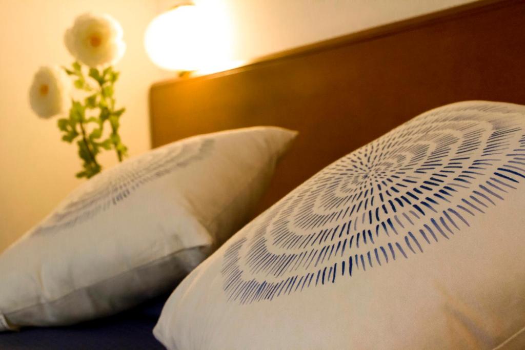 Postel nebo postele na pokoji v ubytování Domus Hotel