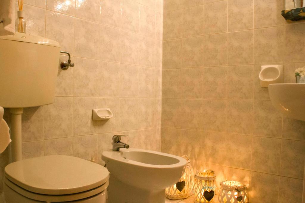 Koupelna v ubytování Domus Hotel