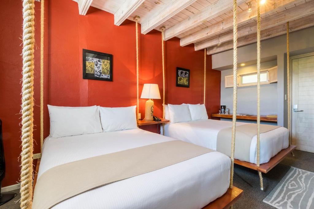 Postel nebo postele na pokoji v ubytování Hotel Damiana Boutique
