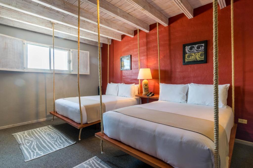 Postel nebo postele na pokoji v ubytování Hotel Damiana Boutique