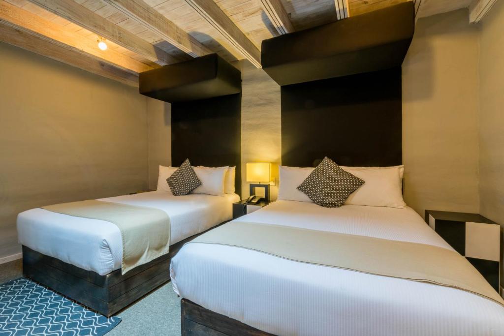 Postel nebo postele na pokoji v ubytování Hotel Damiana Boutique