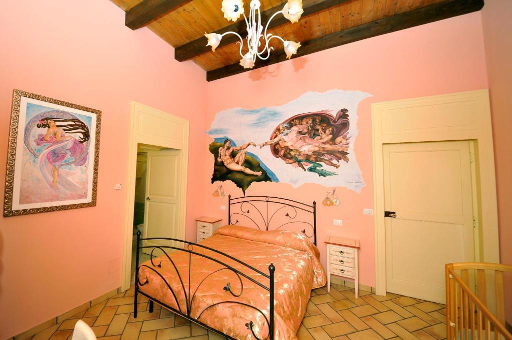 Postel nebo postele na pokoji v ubytování Agriturismo La Palazza