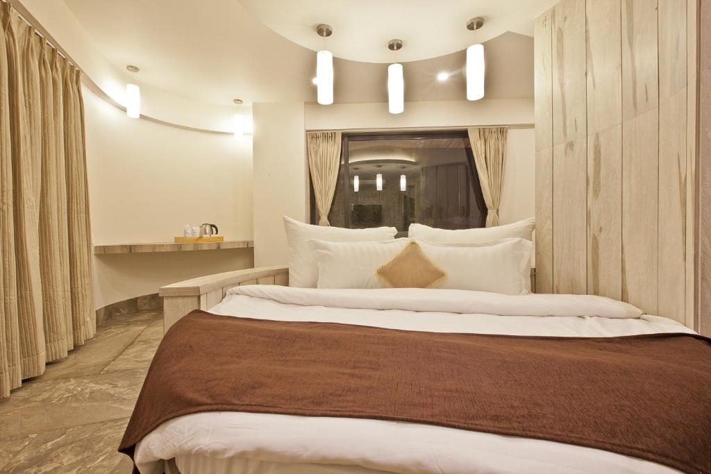 Postel nebo postele na pokoji v ubytování Scenaria Hotel