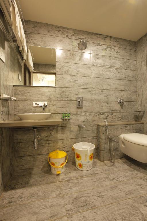 Koupelna v ubytování Scenaria Hotel