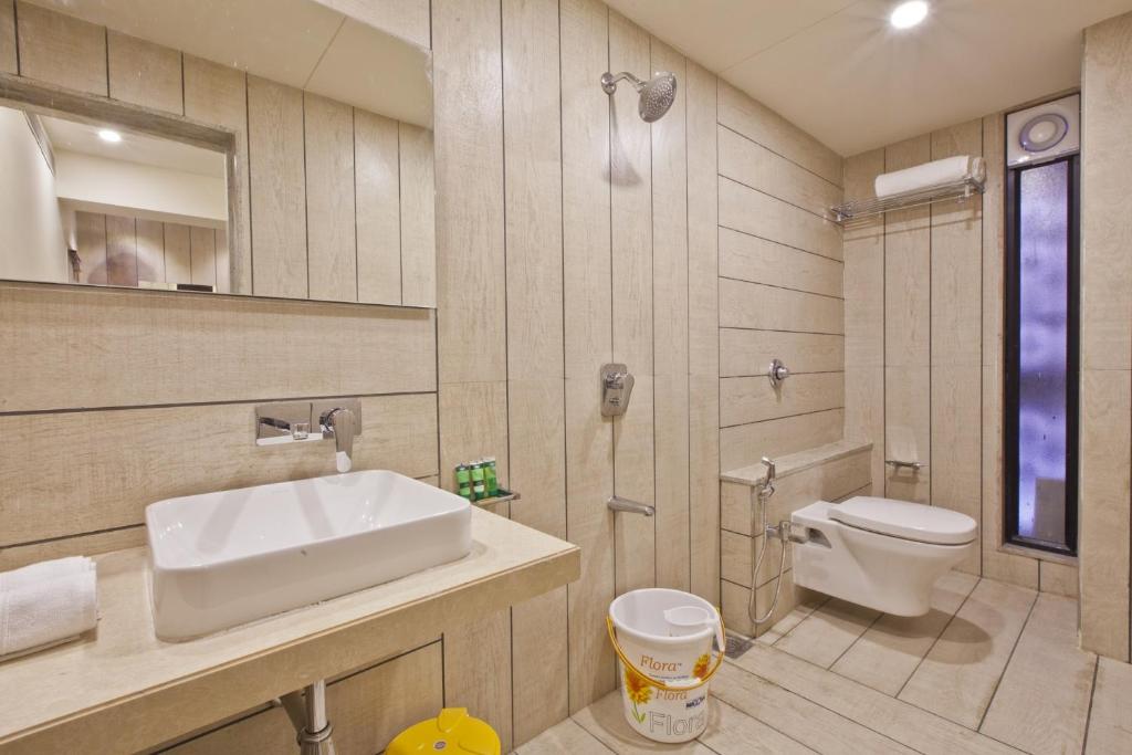 Koupelna v ubytování Scenaria Hotel