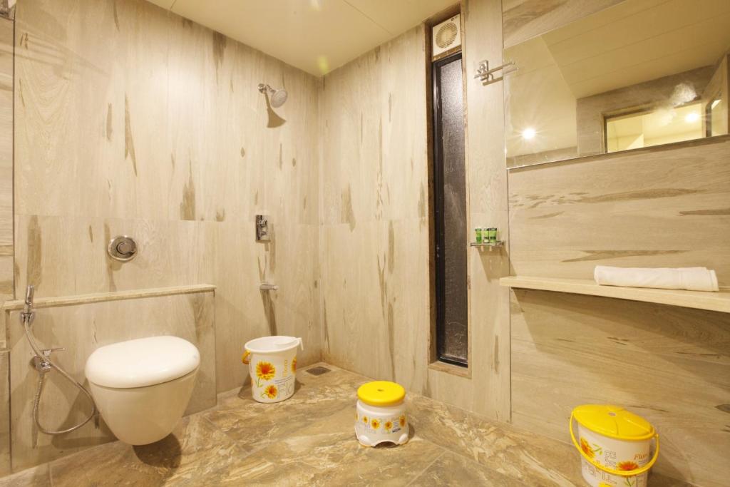 Koupelna v ubytování Scenaria Hotel