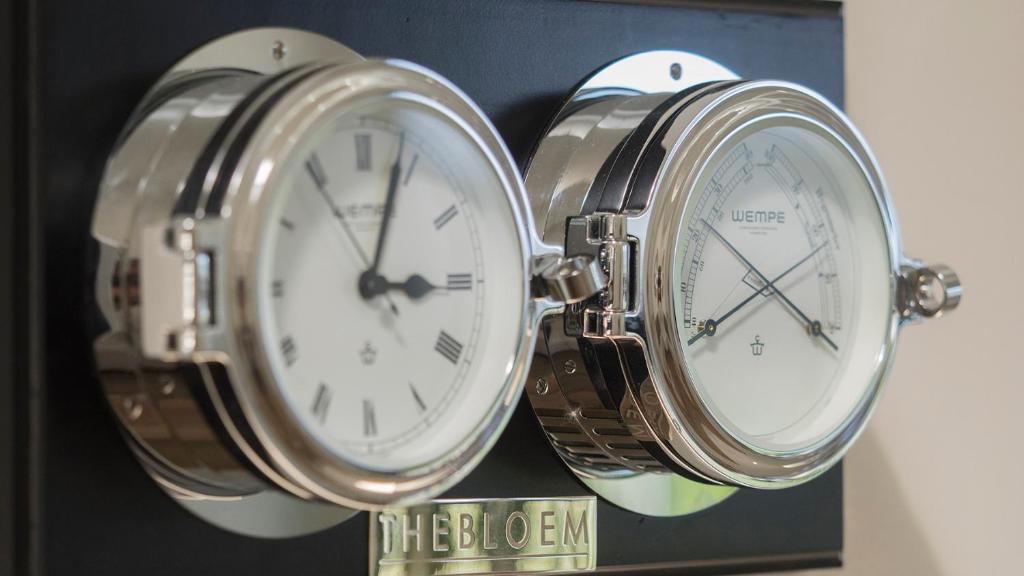 two clocks sitting on top of each other at THEBLOEM Guest Suites by Knysna Paradise Collection in Knysna