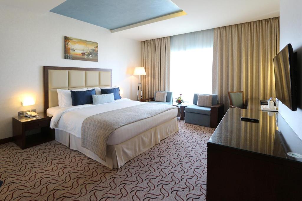 Postel nebo postele na pokoji v ubytování Samaya Hotel Deira