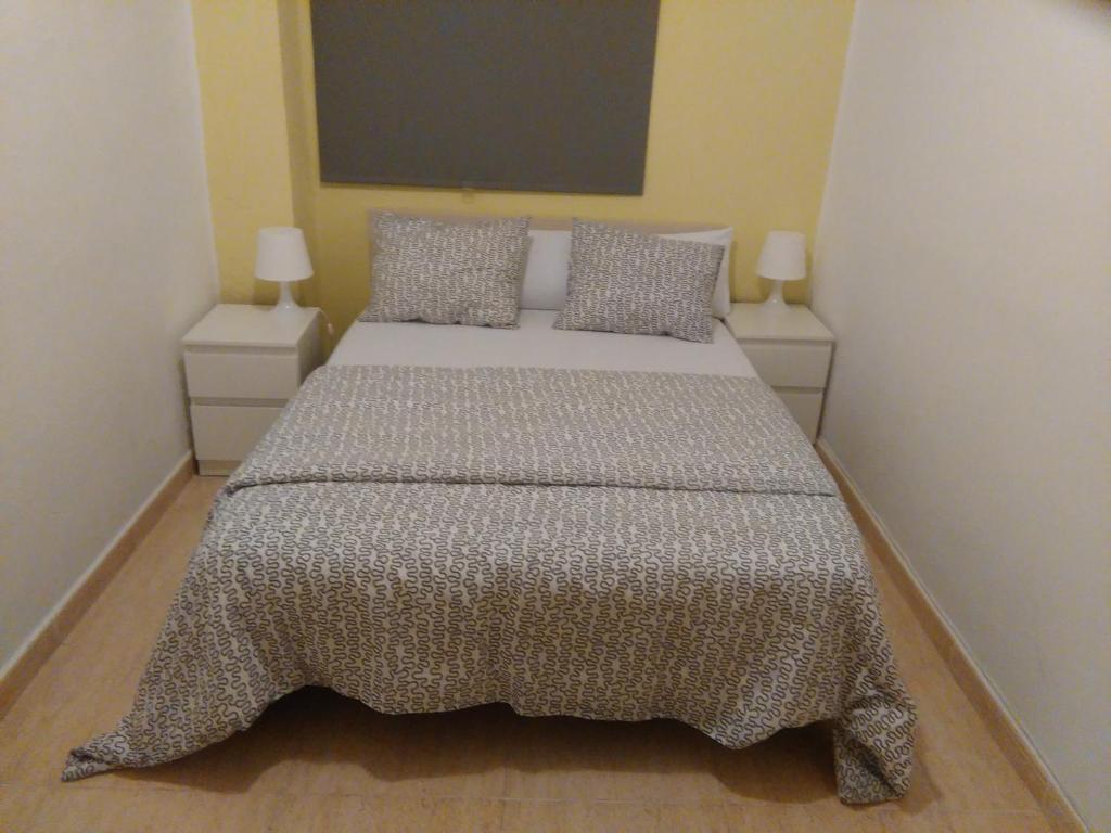 Posteľ alebo postele v izbe v ubytovaní Apartamento Ciudad de las Ciencias