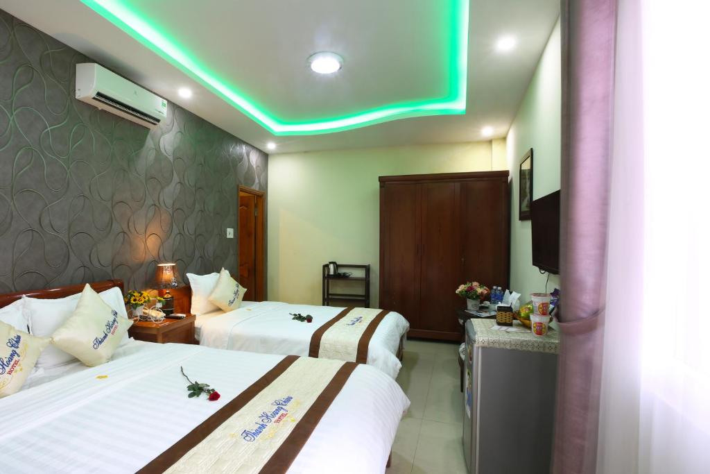Postel nebo postele na pokoji v ubytování Thành Hoàng Châu Boutique Hotel