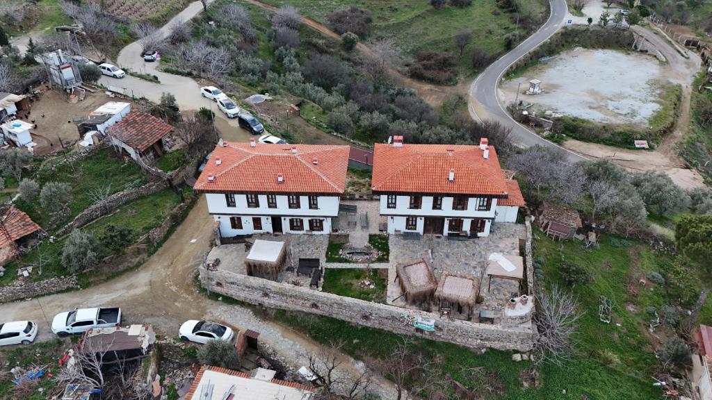 an aerial view of an old house with cars parked at İkiz Konaklar in Selçuk
