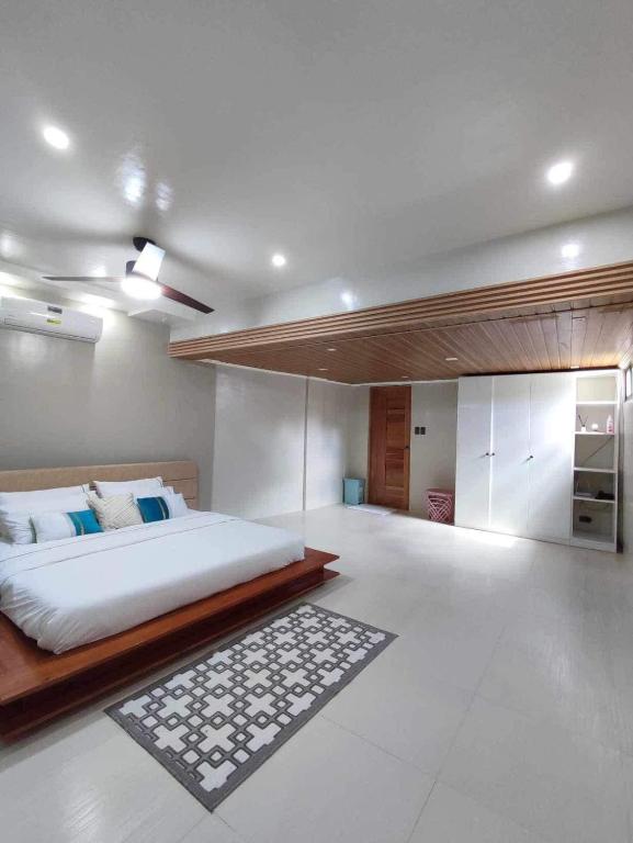 a bedroom with a large bed in a room at Shella Home Stay in Miagao
