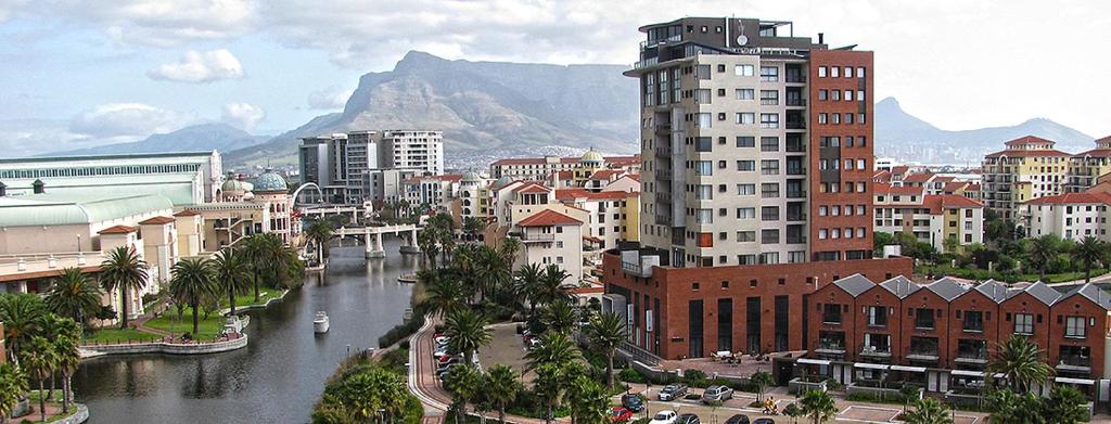 a view of a city with a river and buildings at Manhattan Escape Suite By Ezey Tours in Cape Town