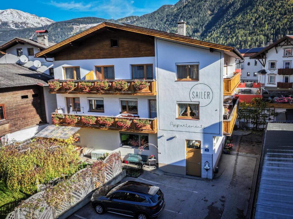 a car parked in front of a building at Appartements Sailer in Prutz