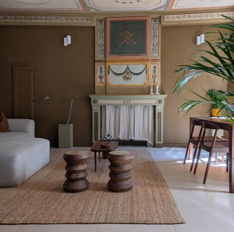 a living room with a couch and a table at Provencal Escape - Suite in Saint Paul de Vence