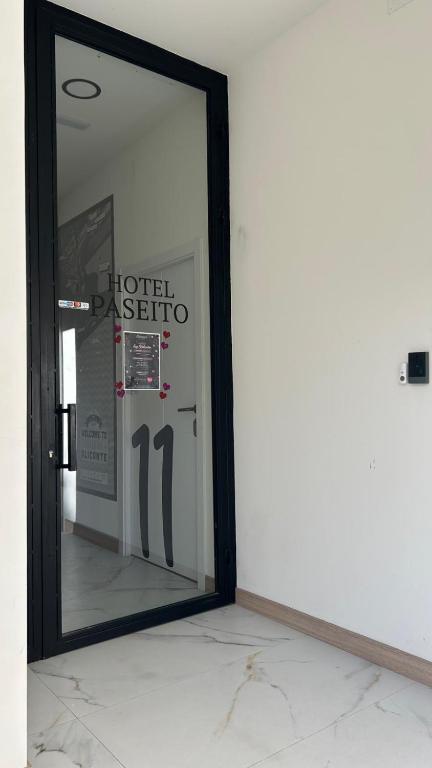 a mirror reflecting the reflection of a hotel backstage at Hotel Paseito in Alicante
