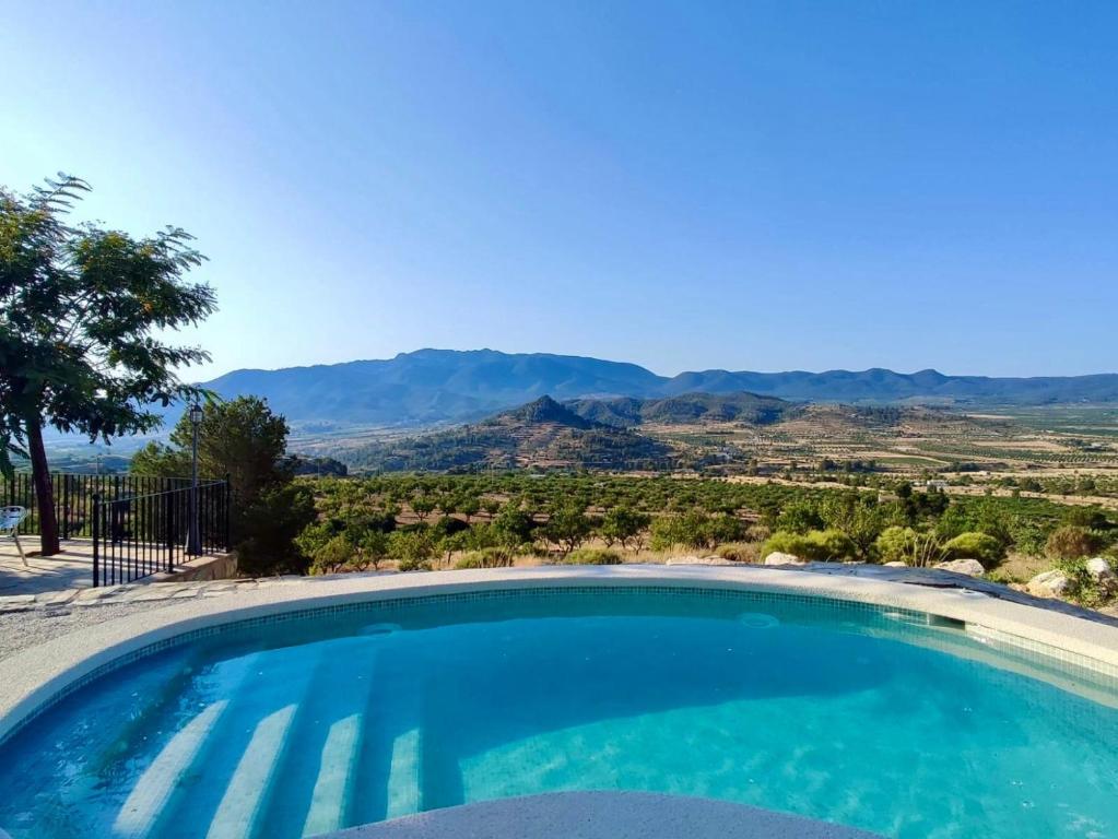 a swimming pool with a view of the mountains at Casa Romeriko piscina privada vistas espectaculares Valle de Ricote Murcia in Ricote