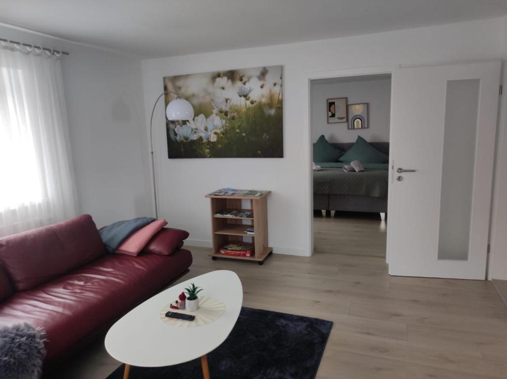 a living room with a couch and a table at Ferienwohnungen Bella in Reutte