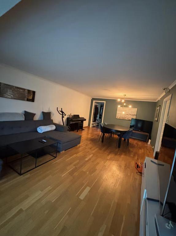 a living room with a couch and a table at Etterstad in Oslo