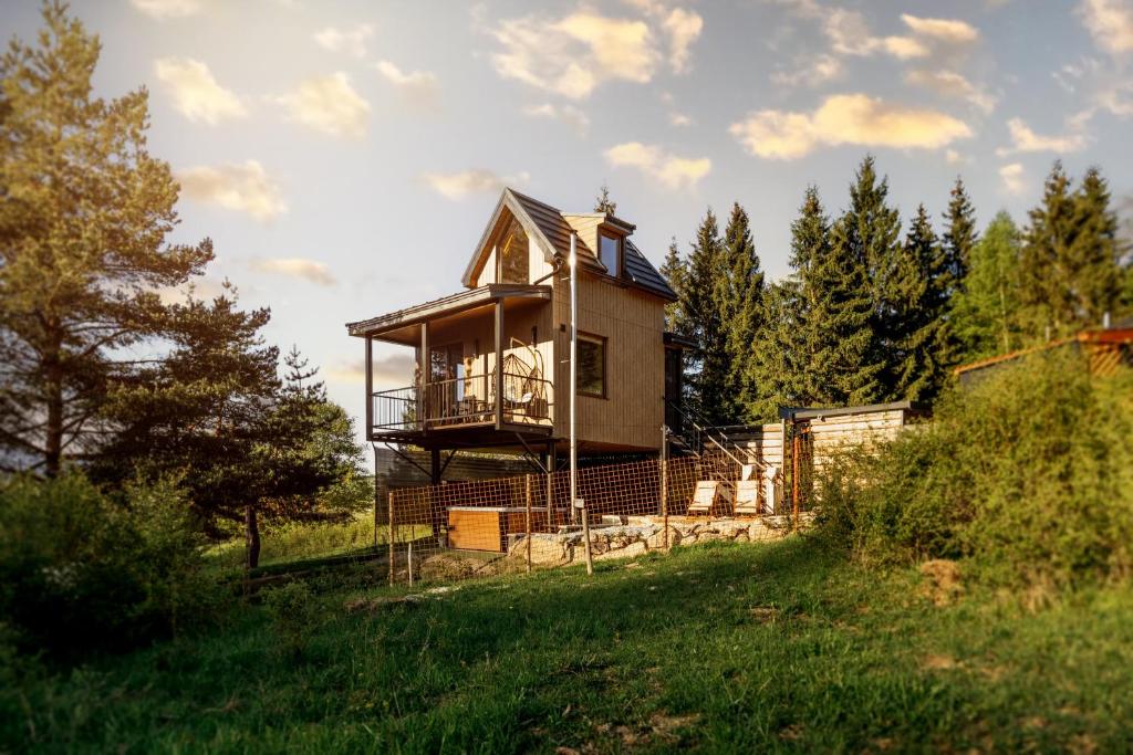 a house under construction in a field with trees at Buda 2 in Komjatná