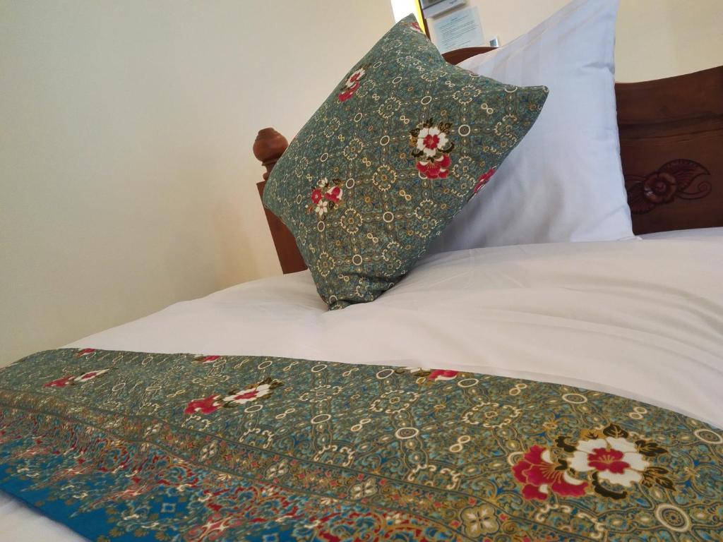 Postel nebo postele na pokoji v ubytování Baan Bussaba Hotel