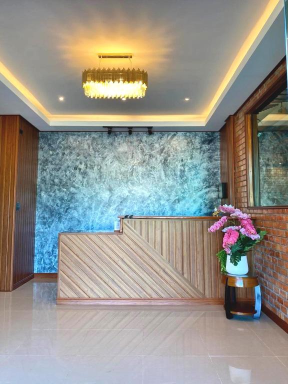 a lobby with a large wall mural in a building at Neo cafe and hotel 2 in Sathani Maruan