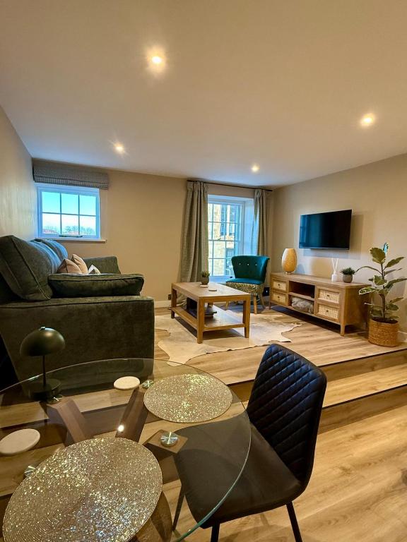 a living room with a couch and a table at Townhouse in Shaftesbury