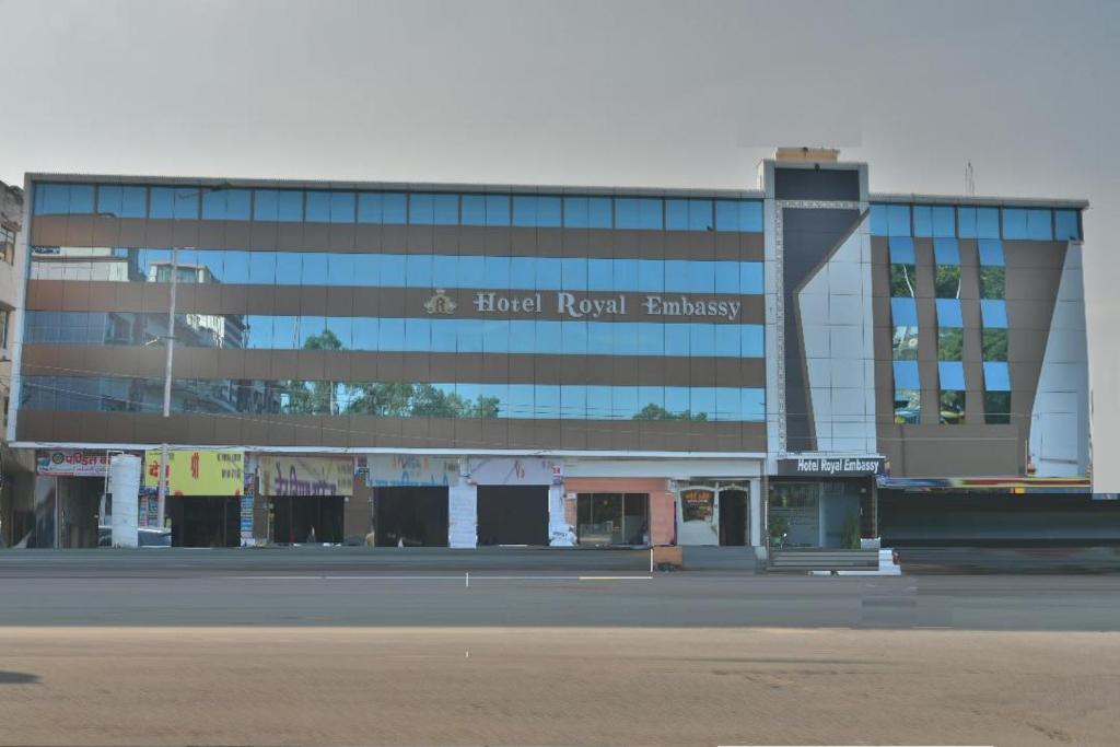 a building with a sign on the side of it at Hotel Royal Embassy in Bhilwara