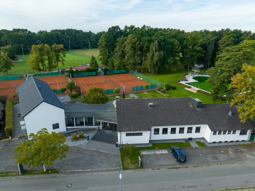 an overhead view of a large white building at Hotel Haus Hohne in Hohne