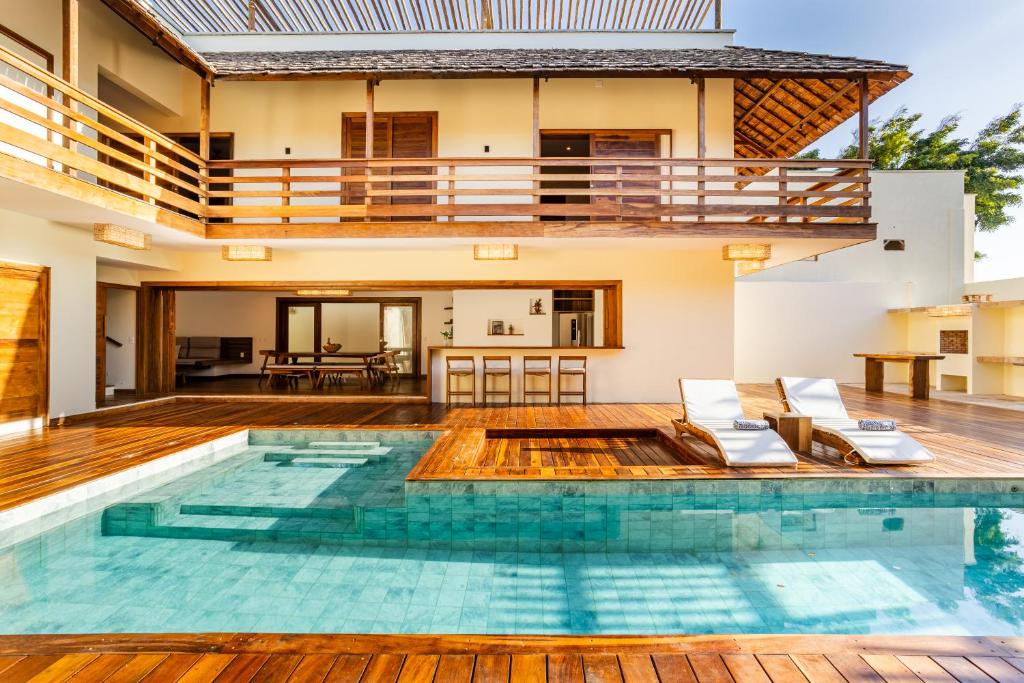 a pool in the middle of a house at Villa Swabrina - Grupo Messina in Jericoacoara