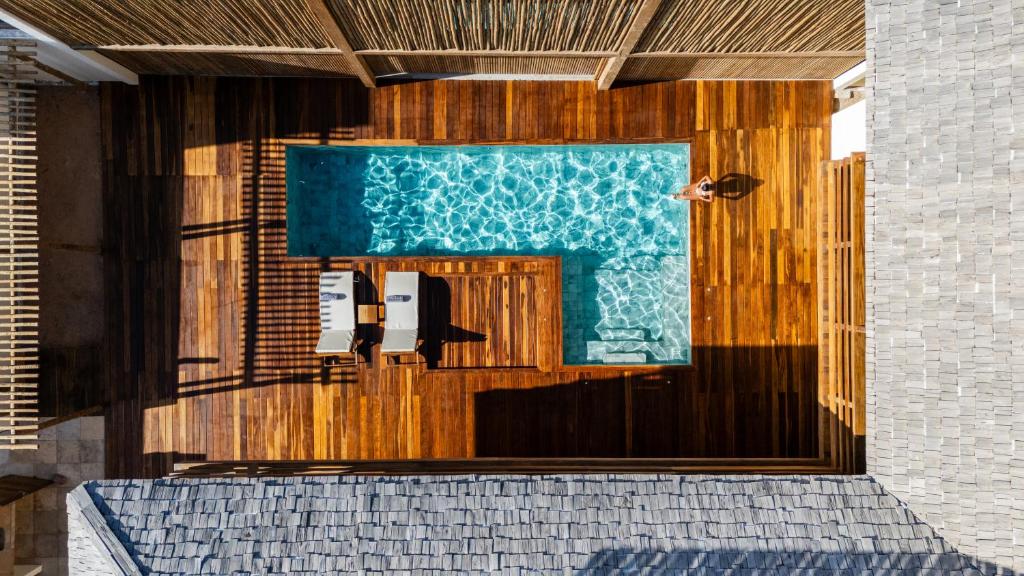 a front door of a building with a pool at Villa Shamsa - Grupo Messina in Jericoacoara