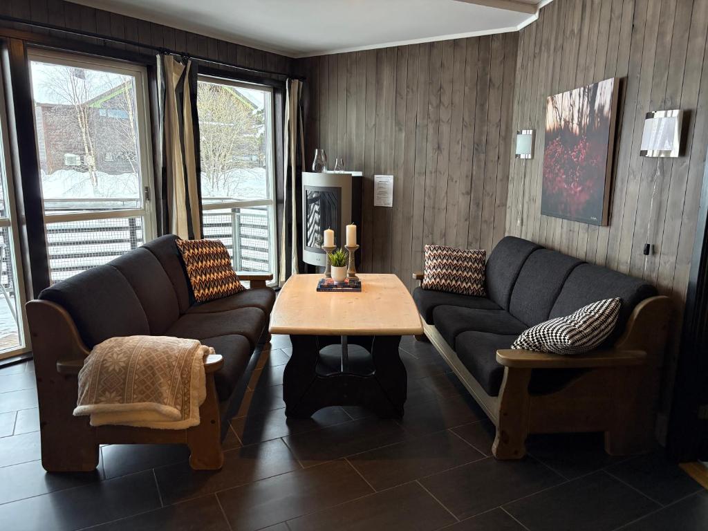 a living room with a couch and a table at Cozy Couples or Family Retreat - Hemsedal in Hemsedal