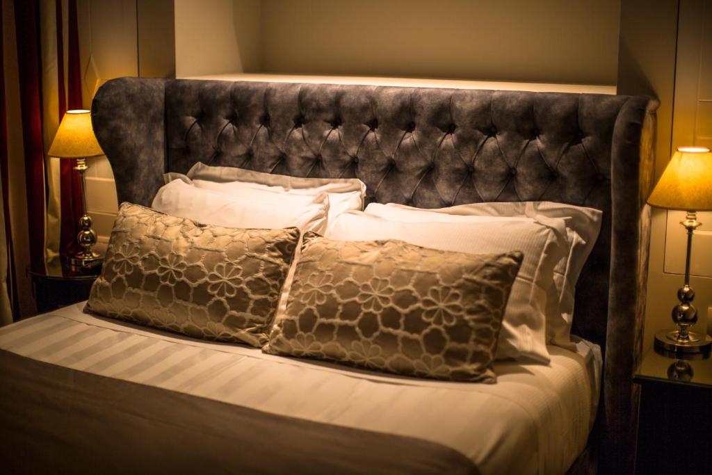 Postel nebo postele na pokoji v ubytování Hotel Monte Cenci
