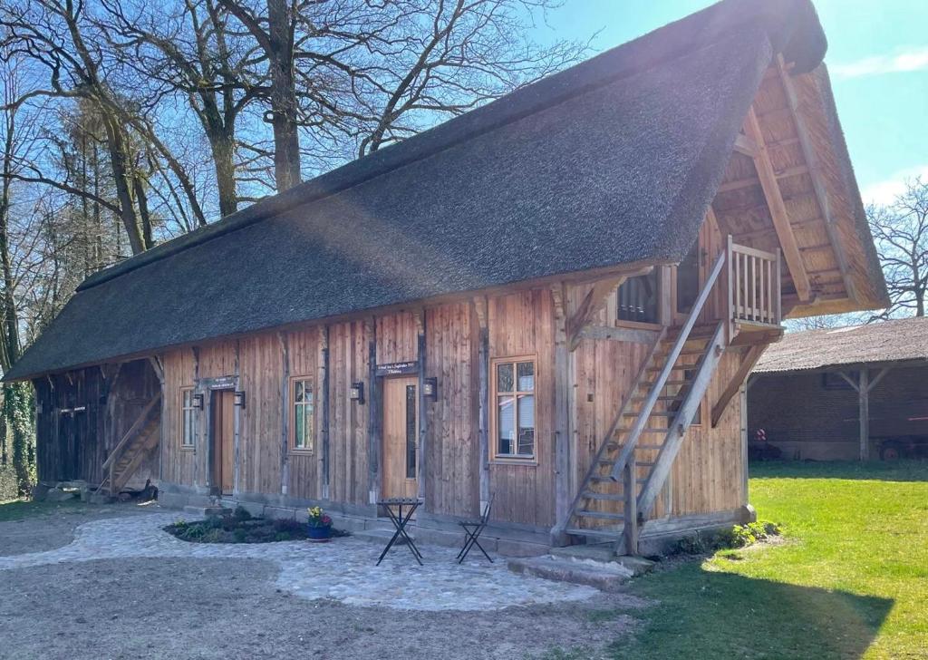 a log cabin with a staircase in front of it at Speicher in Soltau in Soltau