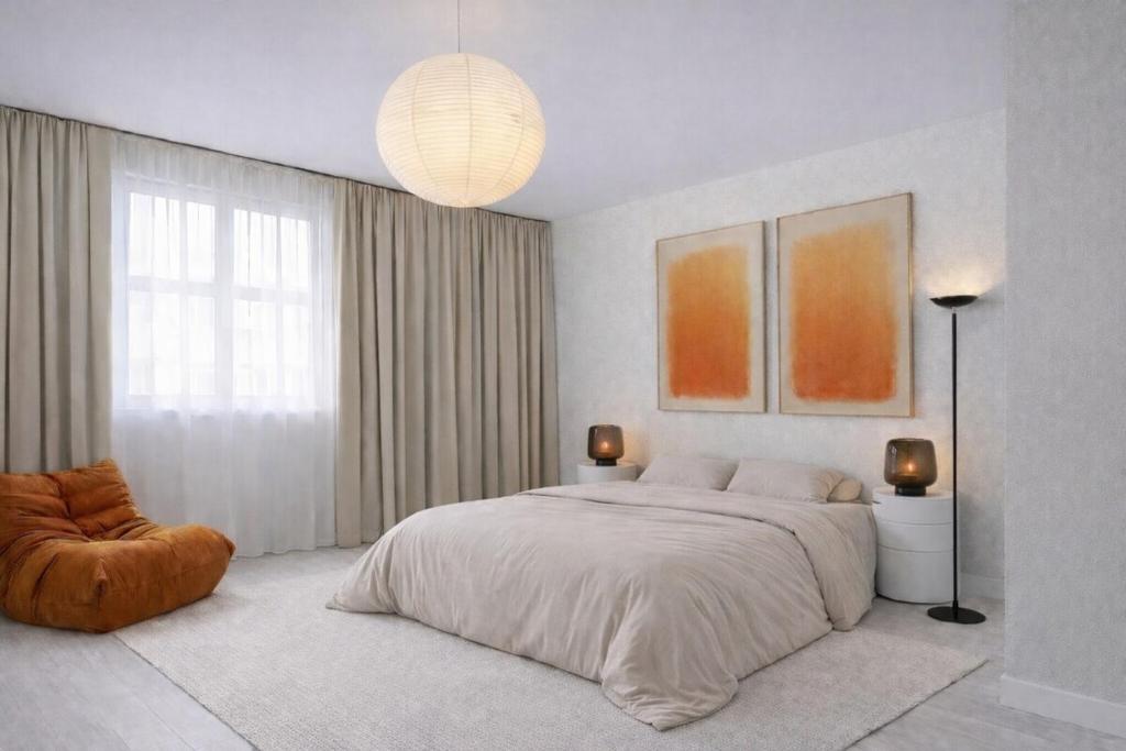 a bedroom with a large bed and a large window at blue house in Saint-Pierre