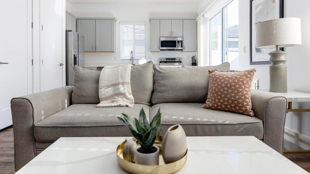 a living room with a couch and a table at Landing Incredible 2BD Gym in Phoenix
