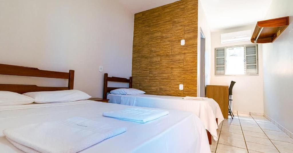 two beds in a room with two beds sidx sidx sidx at Pousada Gran-Café in Quixadá
