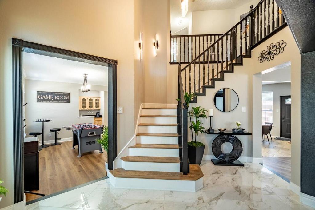 a home with a staircase and a living room at Stylish Oasis Modern Living in Allen